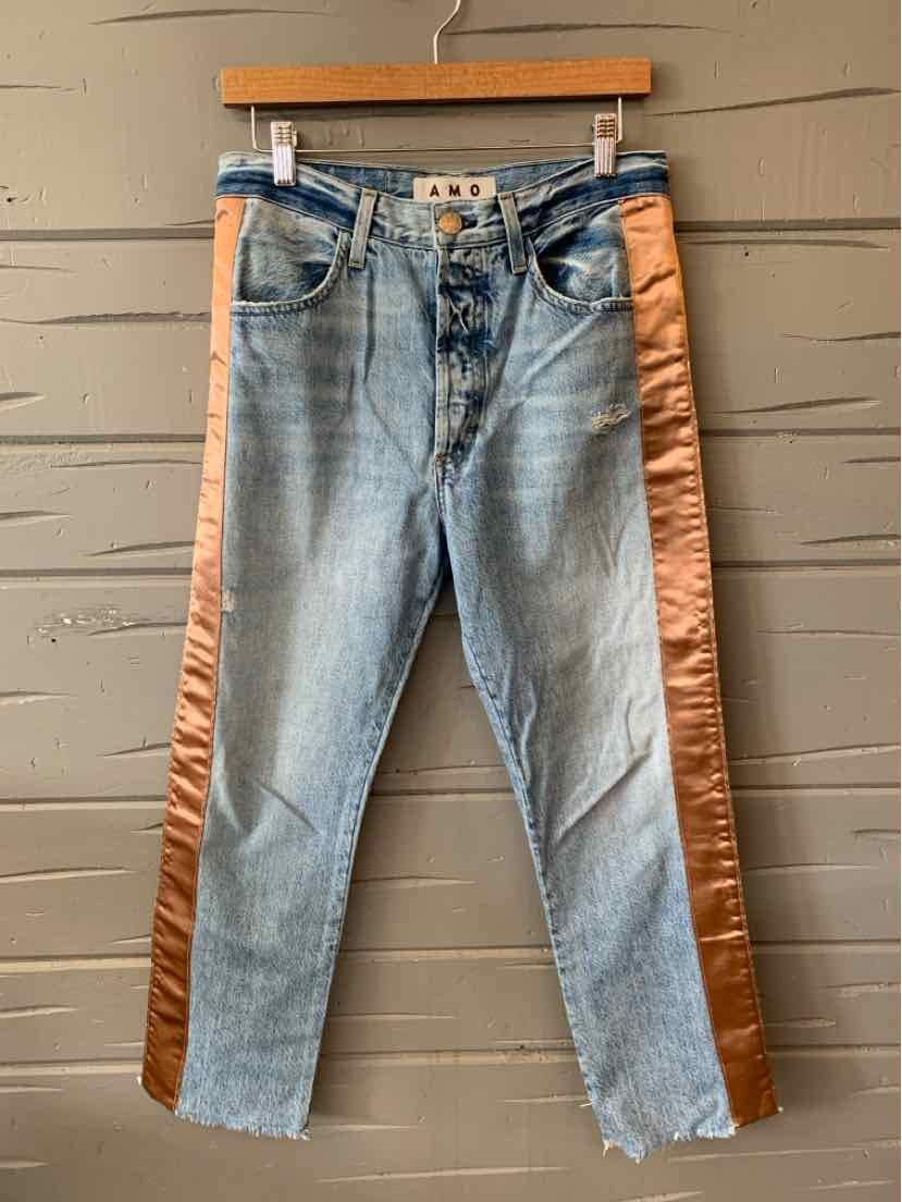 Light wash denim jeans with copper satin side stripes and button fly closure.