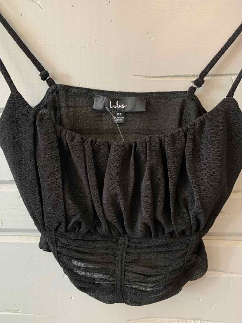 Black ruched cropped tank top with thin adjustable straps and fitted bodice in lightweight fabric.
