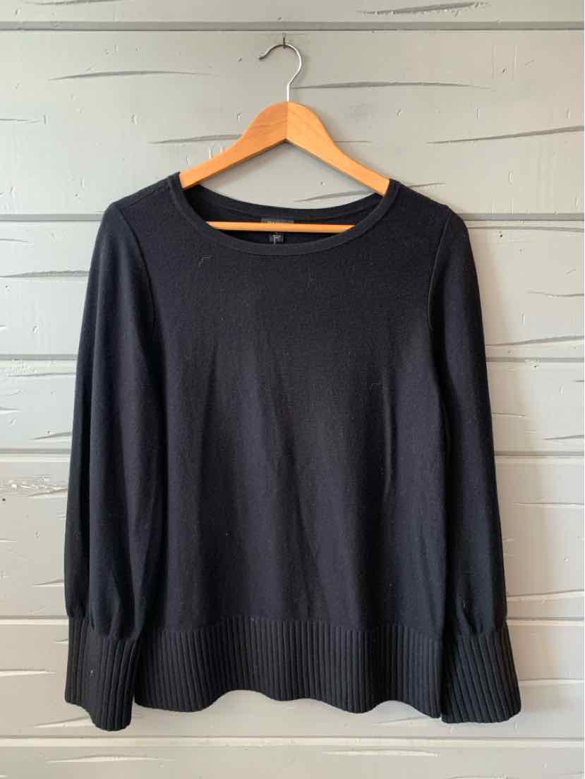 Black long-sleeve sweater with ribbed cuffs and hem, crew neckline, relaxed fit.
