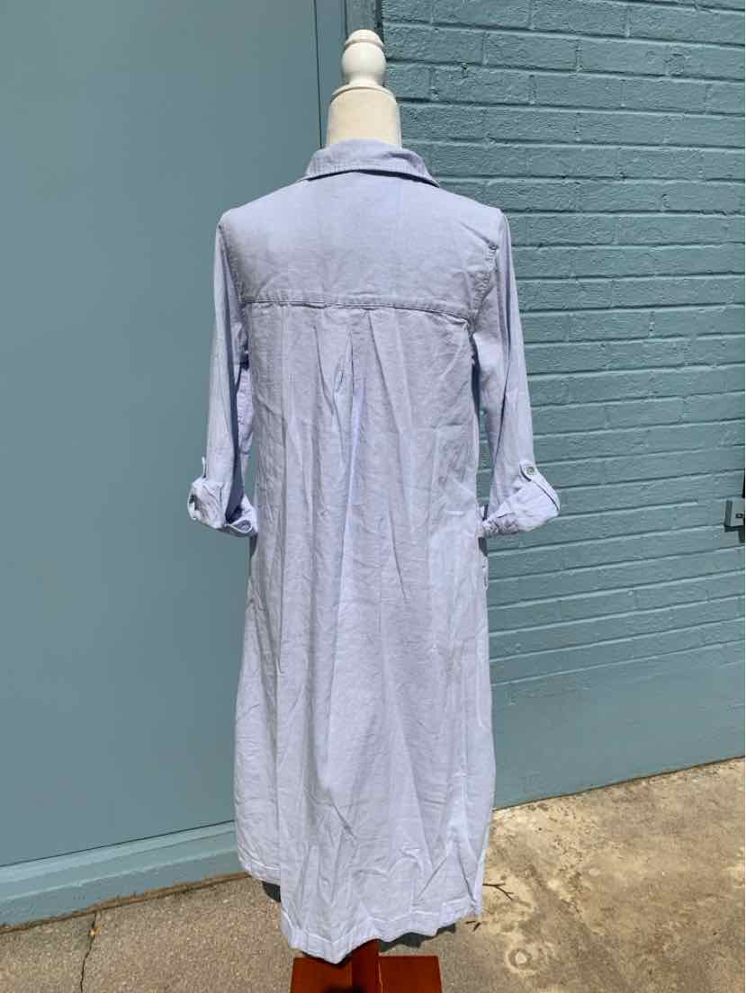 Light blue long shirt dress with rolled-up sleeves and a back yoke detail.