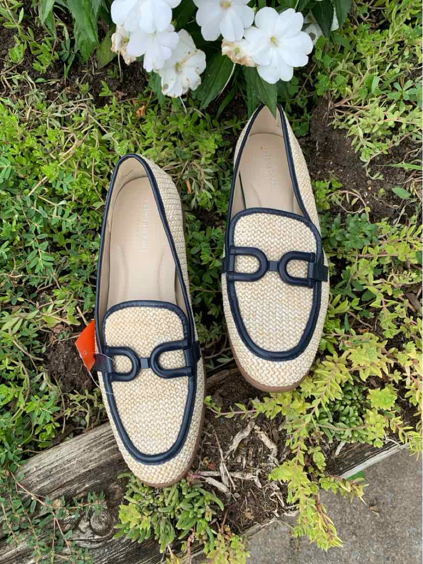 Beige woven slip-on loafers with black trim and decorative black stitching on the vamp, size 9.5.