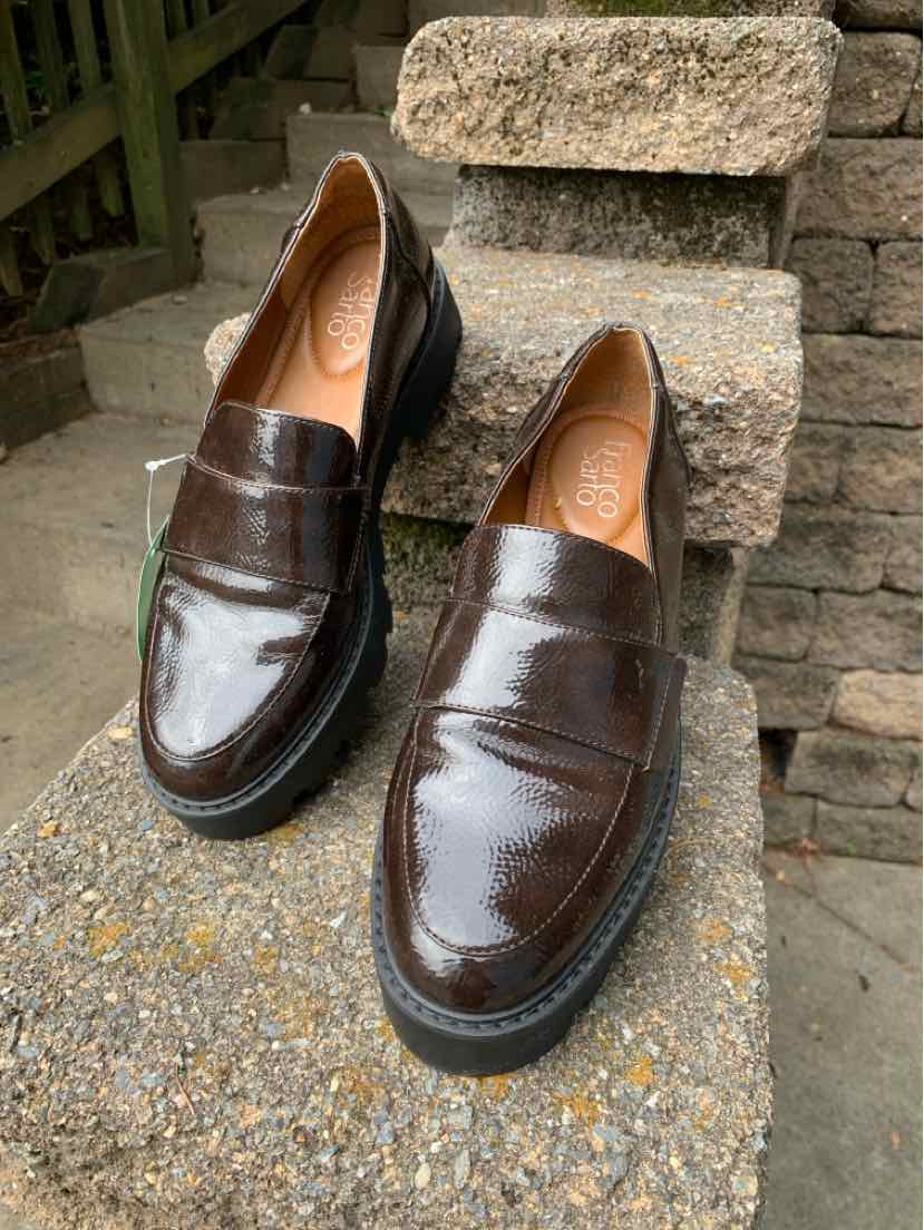 Women’s patent leather dark brown loafers with rounded toes and low heels, size 8.5.