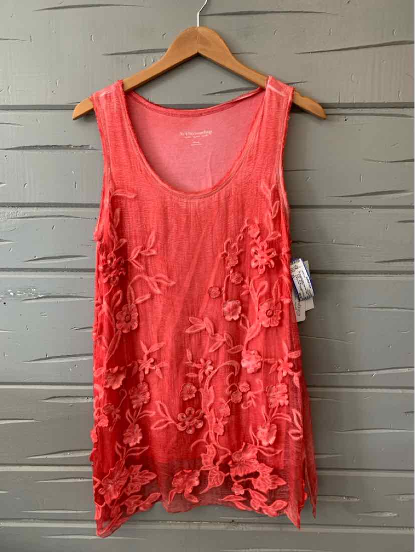 Red sleeveless tank top with floral appliqué details and scoop neckline on wooden hanger.