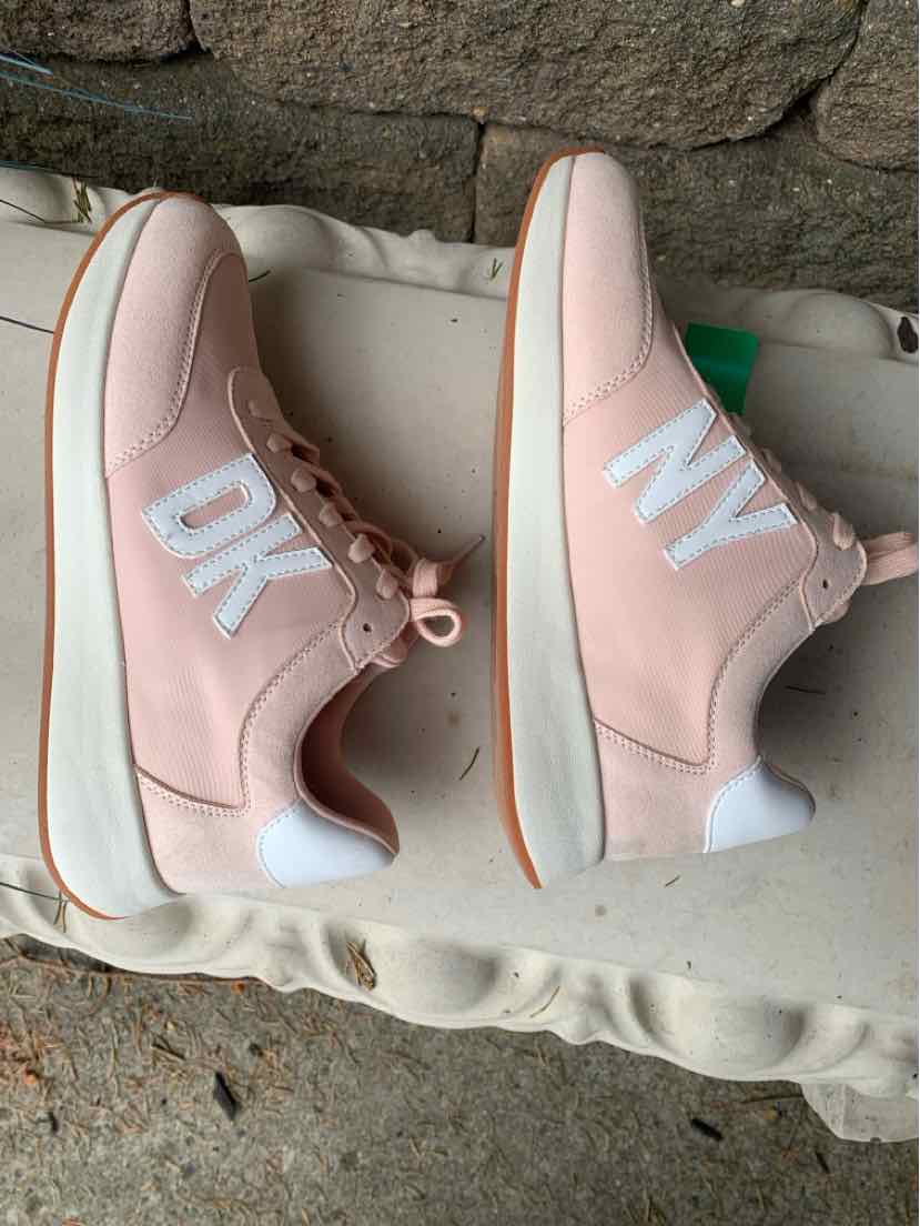 Pink DKNY sneakers size 8 with white "DK" and "NY" lettering, thick white soles.
