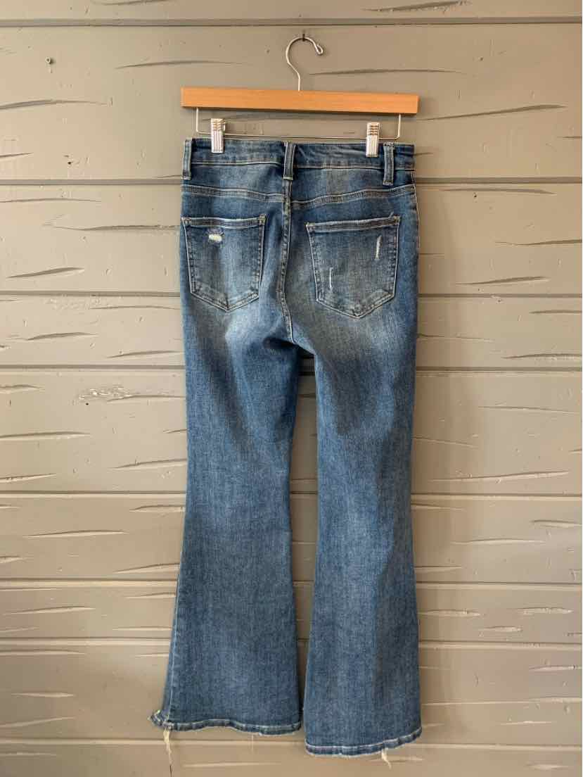 Blue denim jeans with a slightly flared leg and casual faded detailing, size 3, hanging on a wooden hanger.