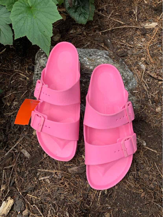 Bright pink double-strap Birkenstock sandal with adjustable buckles and contoured footbed, size 40.