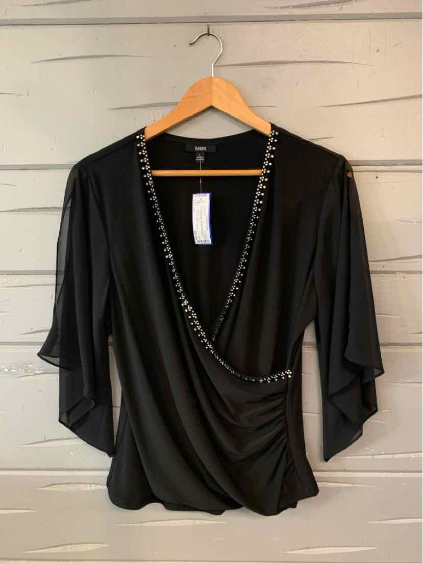 Black women's wrap-style top with a draped neckline, silver chain trim, and flowing three-quarter sleeves.