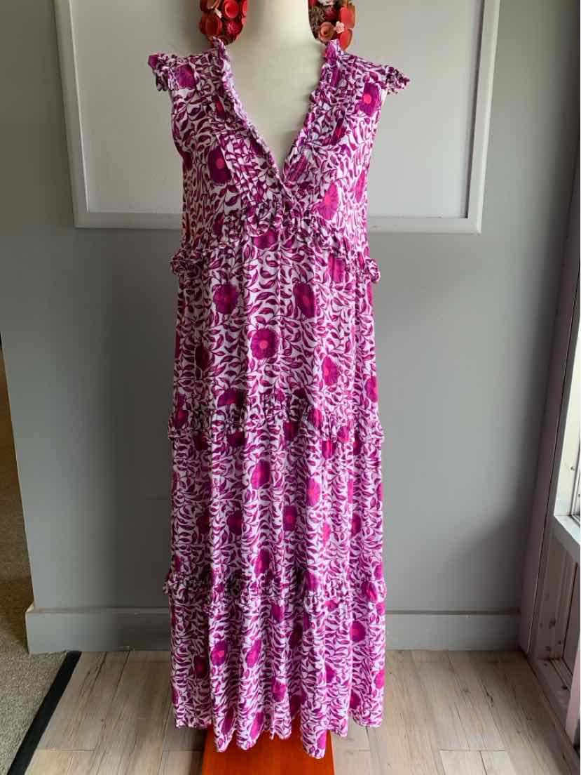 Pink and white floral maxi dress with ruffled V-neck and cap sleeves.