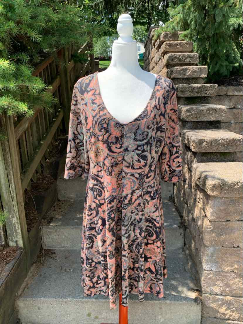 Long-sleeve dress in earthy tones with intricate Peruvian-inspired patterns and a scoop neckline, size XL.