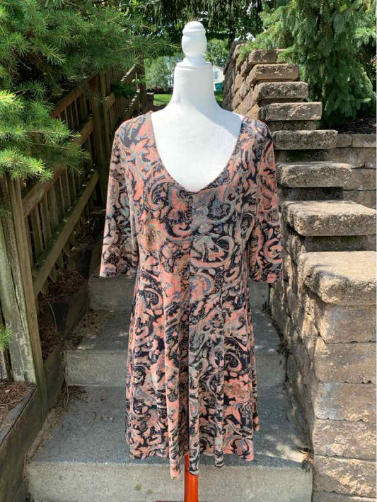 Long-sleeve dress in earthy tones with intricate Peruvian-inspired patterns and a scoop neckline, size XL.