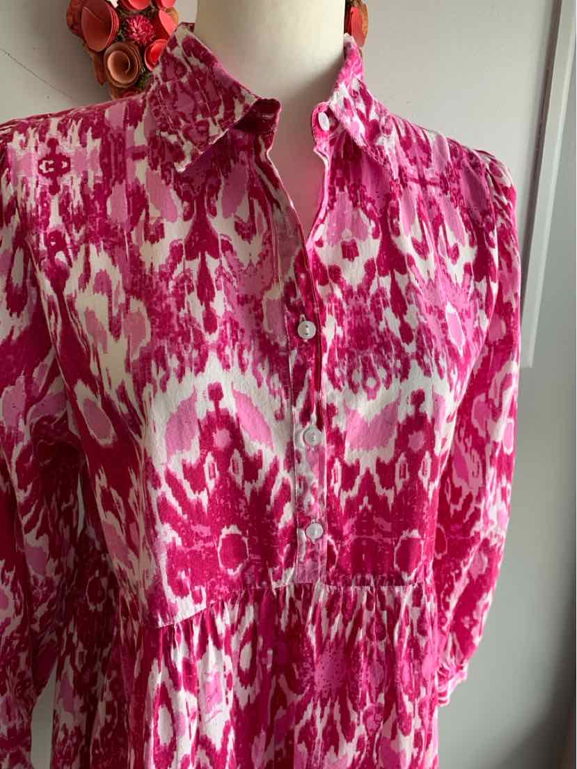 Pink and white patterned long-sleeve blouse with collar and buttoned front, medium size.