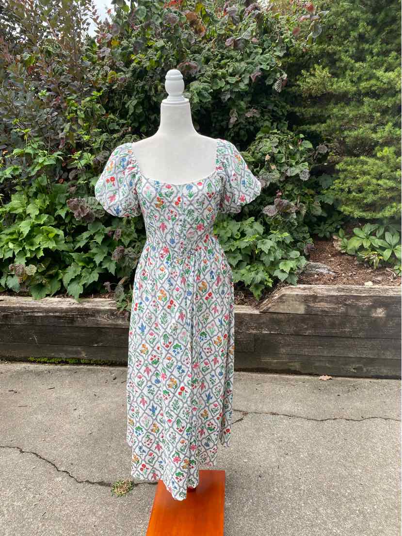 Floral midi dress with puff sleeves, square neckline, and fitted waist in multicolor on white background.
