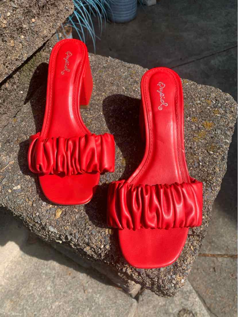 Red ruched open-toe slide sandals with block heels and cushioned insoles, size 7.