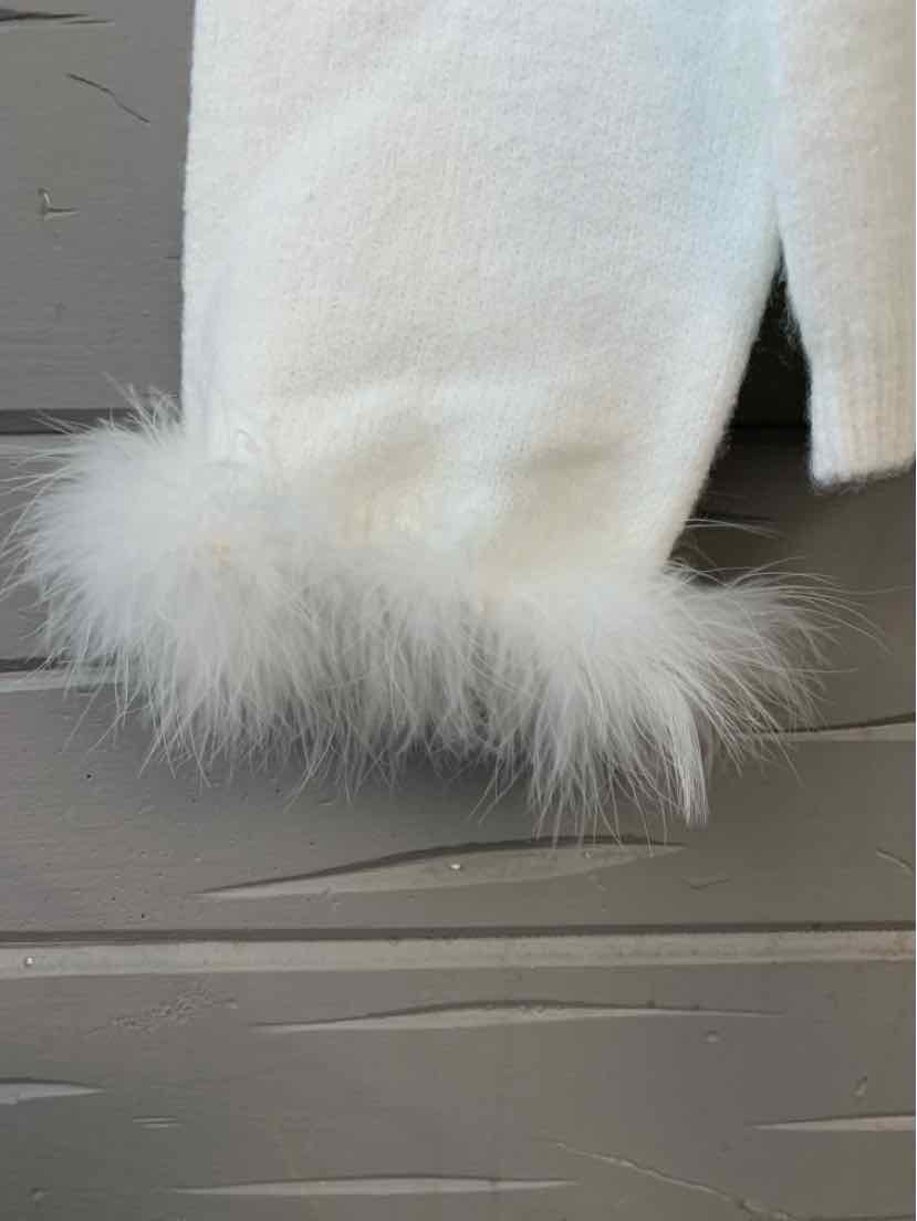 White textured knit sweater sleeve with fluffy feather trim at cuff.