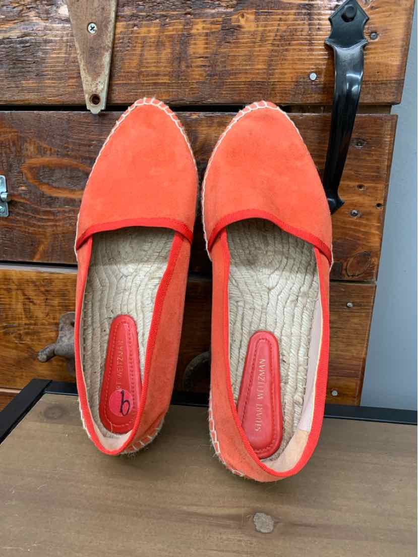 Orange suede slip-on shoes with rounded toes and beige woven soles, size 9.