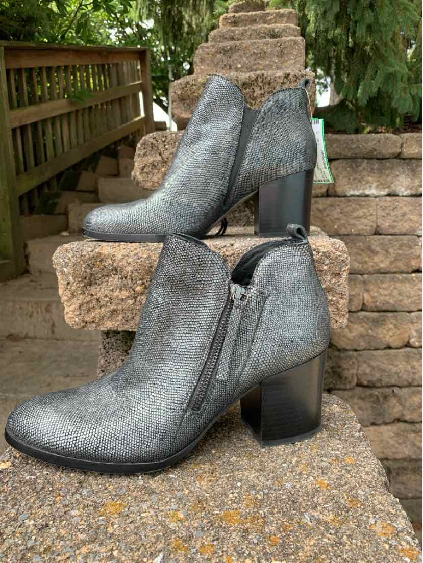 Metallic silver ankle boots with block heels, side zipper, and pointed toes, size 9.