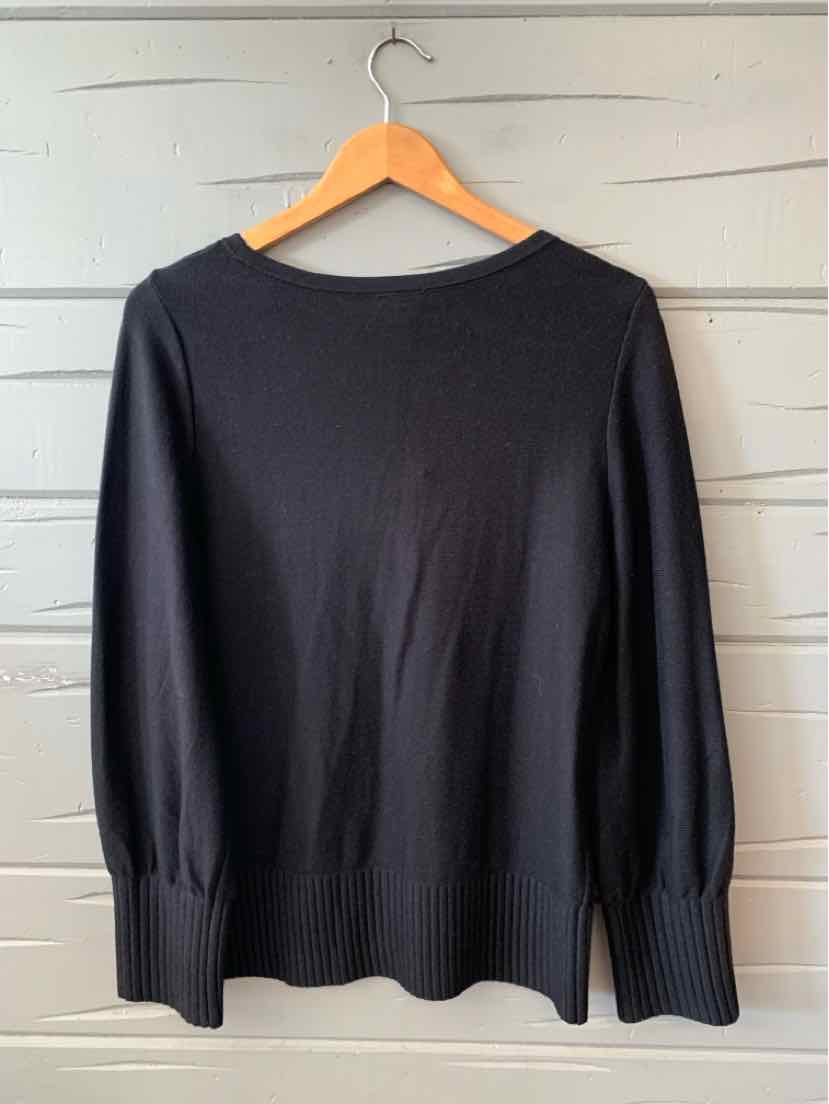 Black long-sleeve knit sweater with ribbed cuffs and hem, round neckline, size large.