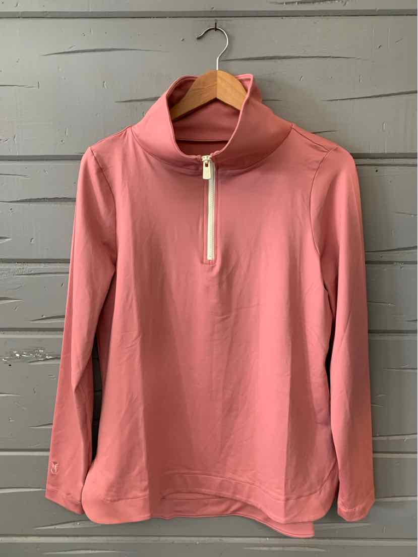 Pink quarter-zip pullover with stand collar and long sleeves on wooden hanger against gray wall.