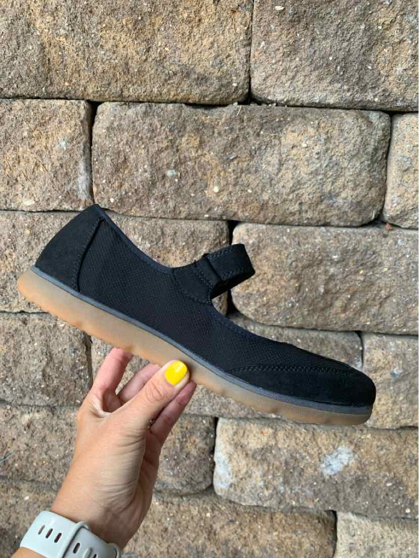 Black Mary Jane-style athletic shoe with Velcro strap and gum sole, size 8.5.