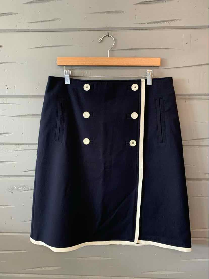 Navy blue A-line skirt with white trim and double row of white buttons down front.