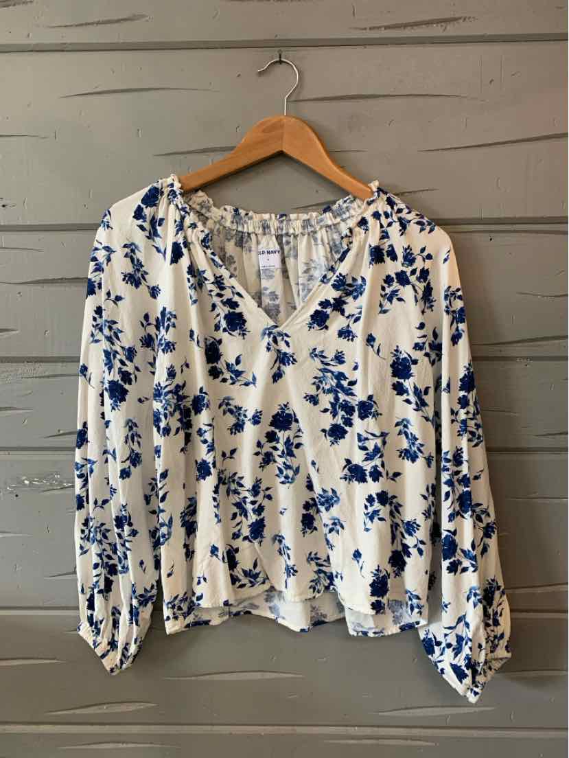 White long-sleeve blouse with blue floral print, V-neck, and gathered cuffs, size medium.