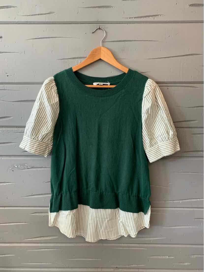 Green knit top with short, puffed white sleeves and a white hem detail.