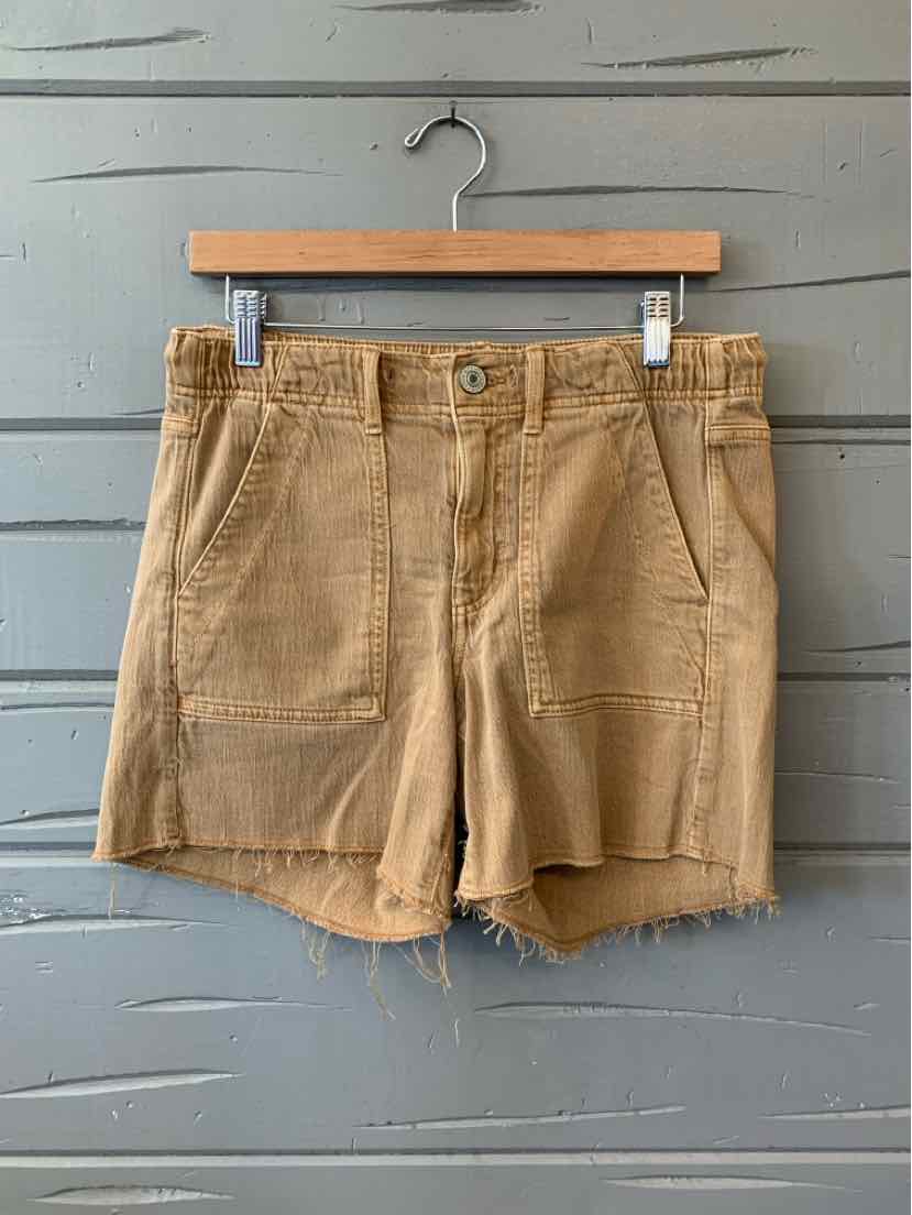 Tan high-waist denim shorts with front patch pockets and a frayed hem, size 4.