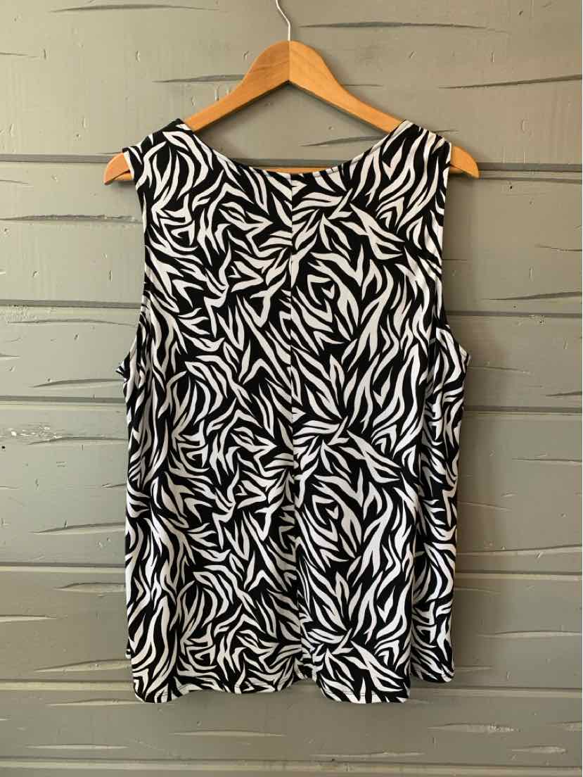Black and white sleeveless blouse with abstract geometric leaf pattern, loose fit, scoop neckline.