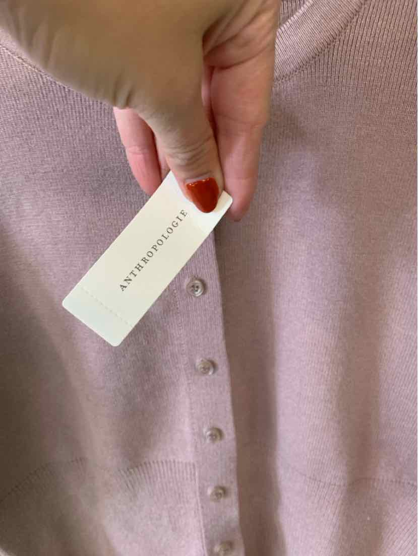 Mauve solid women’s top with a soft textured fabric, front buttons, and a white brand tag.
