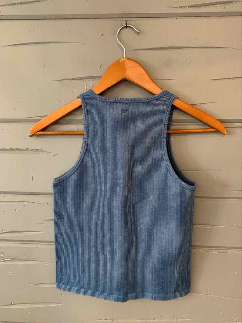 Blue sleeveless ribbed knit tank top with a round neckline hanging on a wooden hanger.