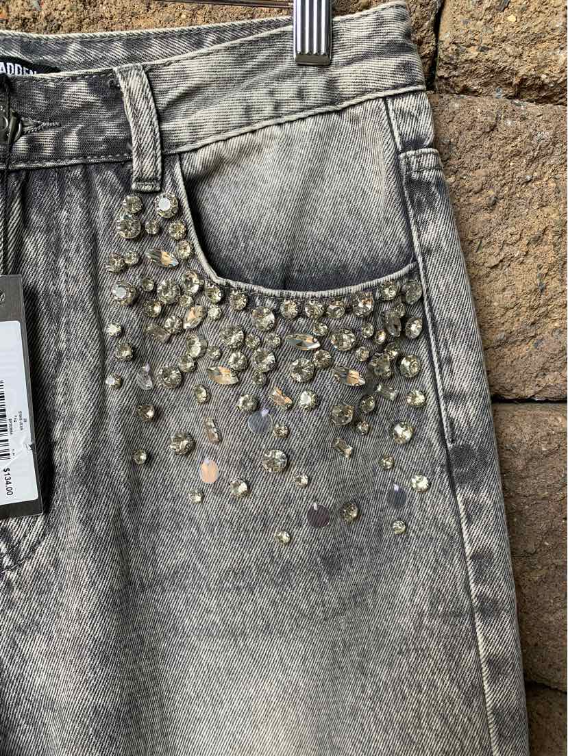 Gray denim jeans with studded rhinestone embellishments on front pocket area.