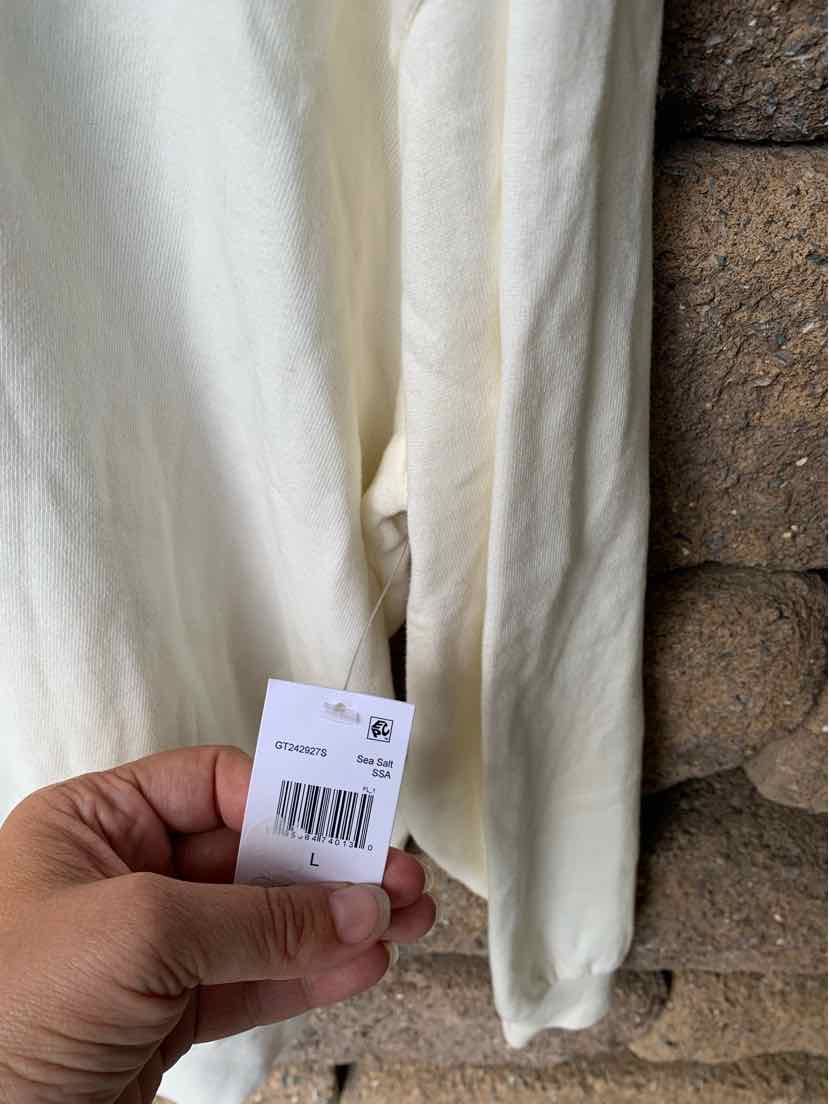 Off-white long-sleeve lightweight cotton shirt with a size large tag and subtle ribbed texture.