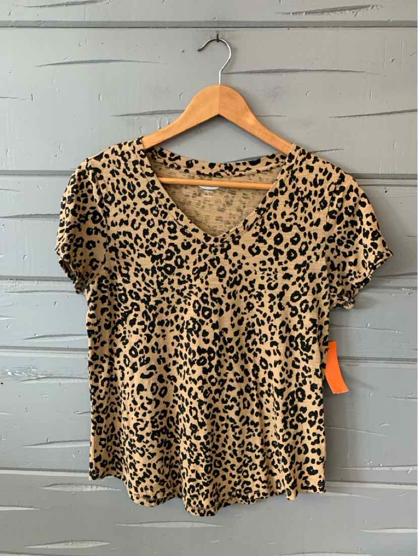 Short-sleeve V-neck leopard print blouse in beige and black on wooden hanger.