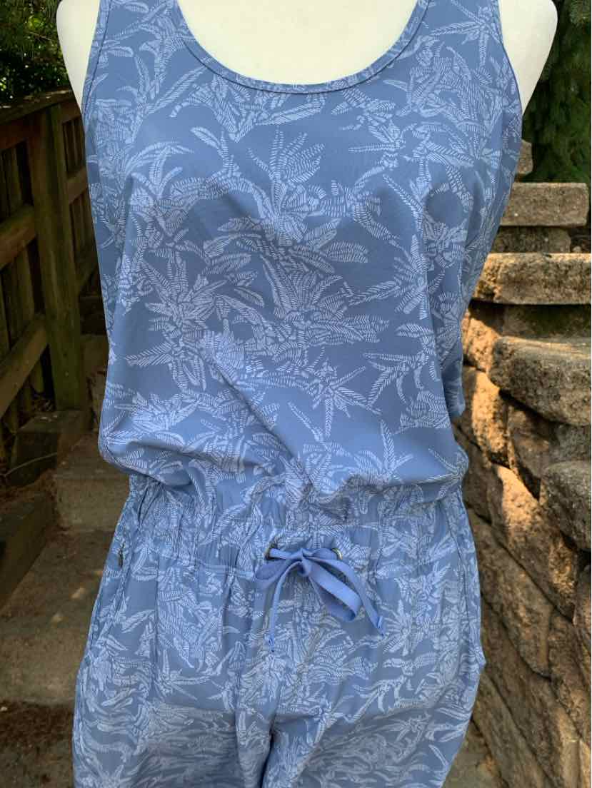 Blue sleeveless women's jumpsuit with subtle floral pattern and drawstring waist.