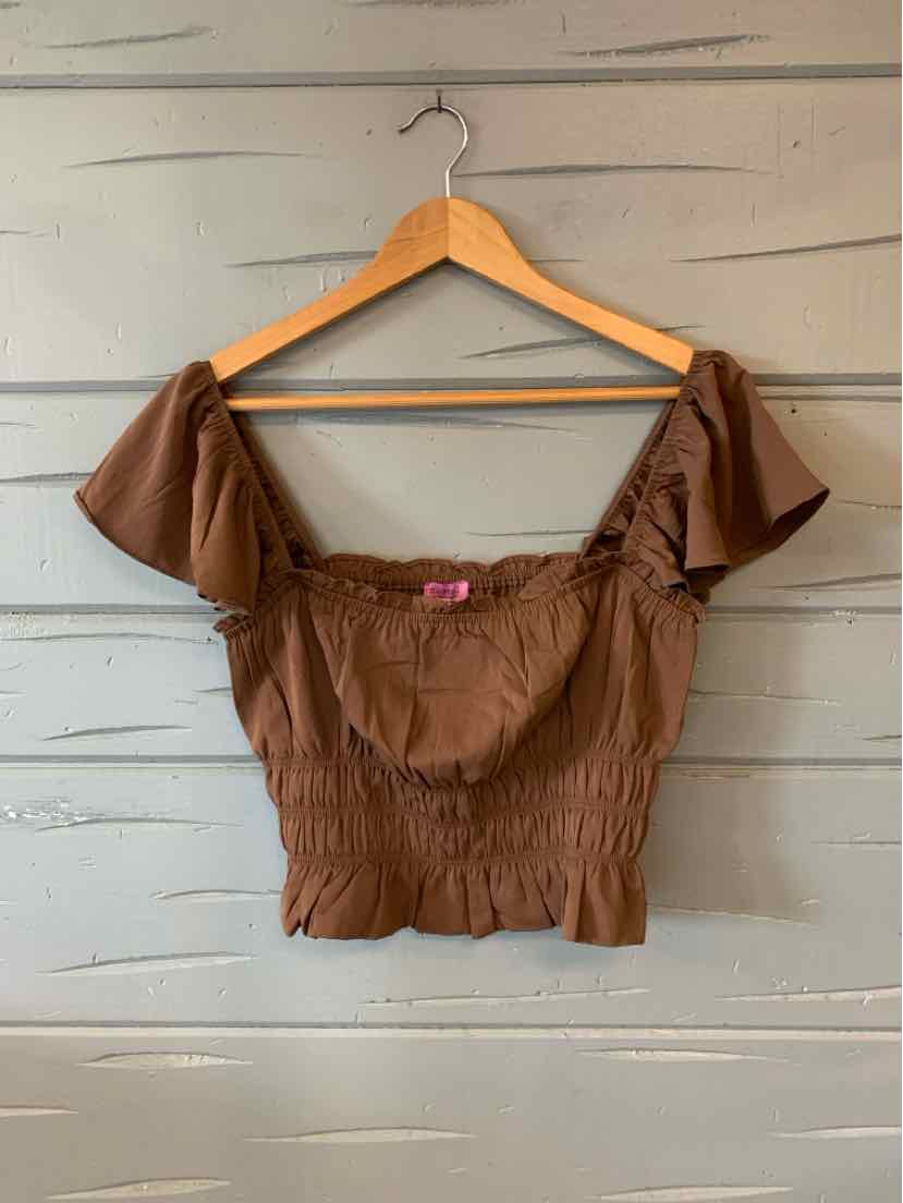 Brown off-shoulder cropped top with puff sleeves and ruched bodice on wooden hanger.