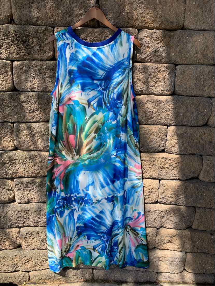 Sleeveless maxi dress with blue, green, and pink abstract floral print.