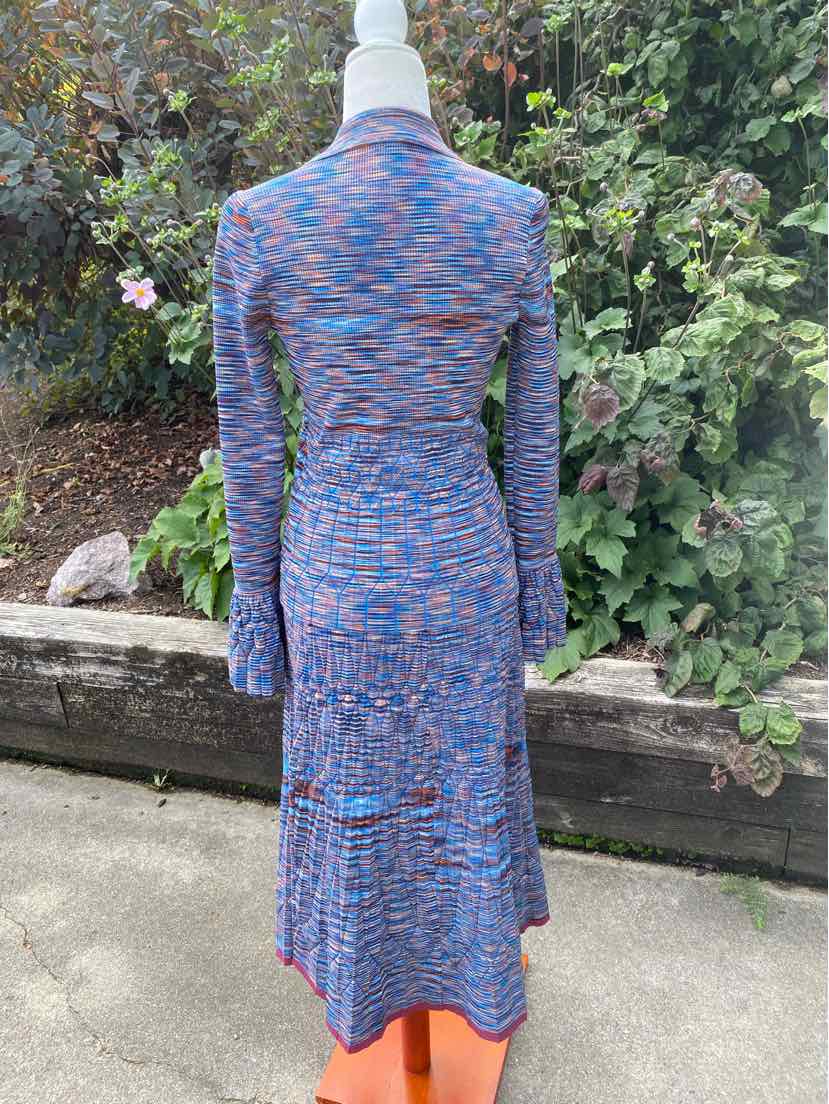 Blue and pink space-dyed fitted two-piece dress set with long sleeves and midi skirt.