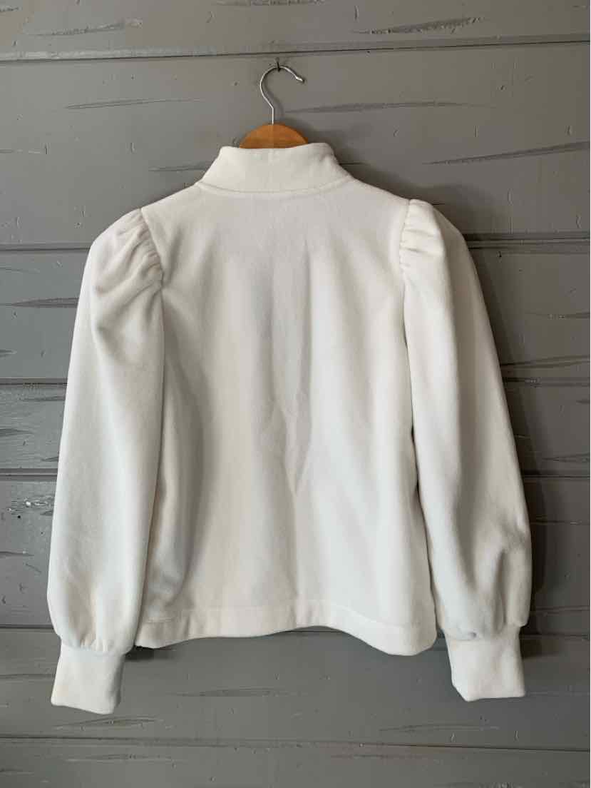 White fleece pullover with a high neckline, puffed shoulders, long sleeves, and ribbed cuffs.