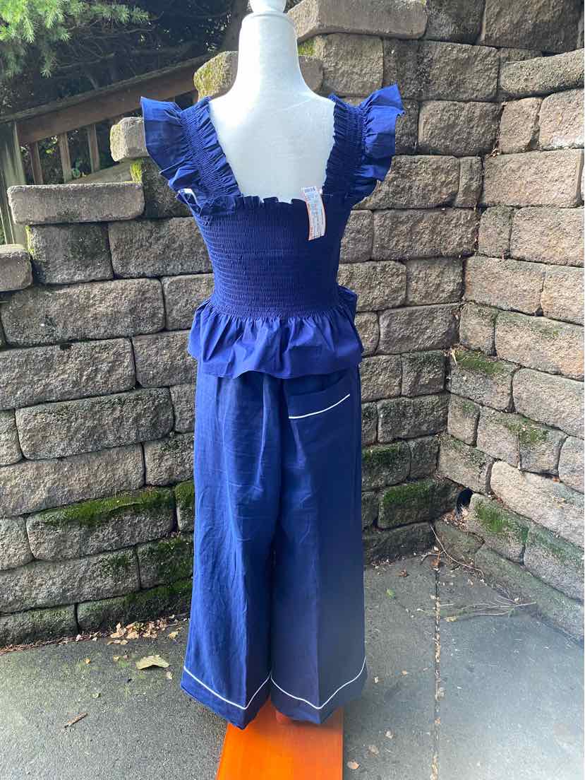 Navy blue two-piece outfit with ruffled short sleeves, square neckline, and wide-leg pants with white stitching.