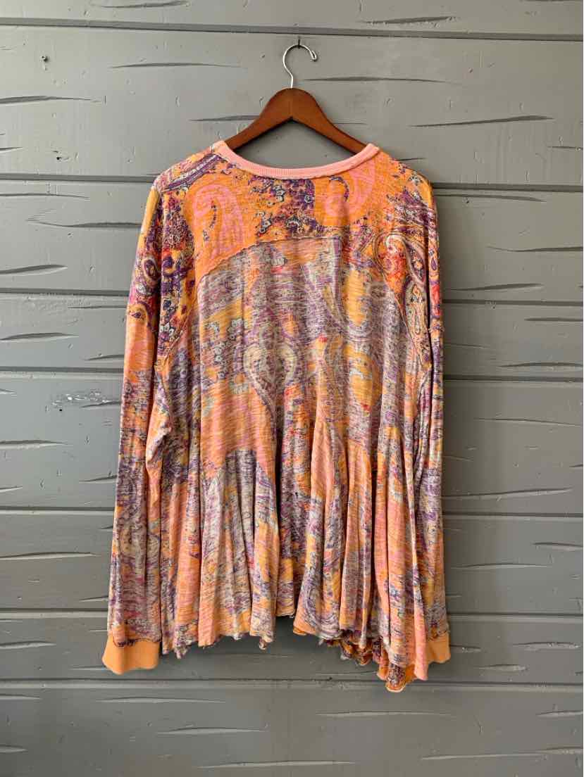 Long-sleeve flowy top with orange paisley pattern and soft ribbed cuffs in small size.