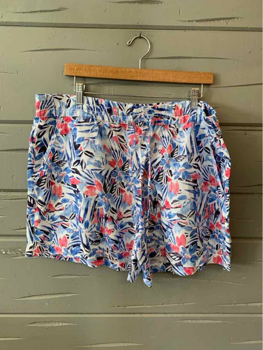 Men’s XL Tommy Bahama shorts with blue, red, and white tropical leaf pattern and drawstring waist.
