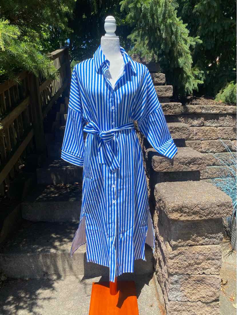 Blue and white striped knee-length shirt dress with collar, long sleeves, and waist tie belt.