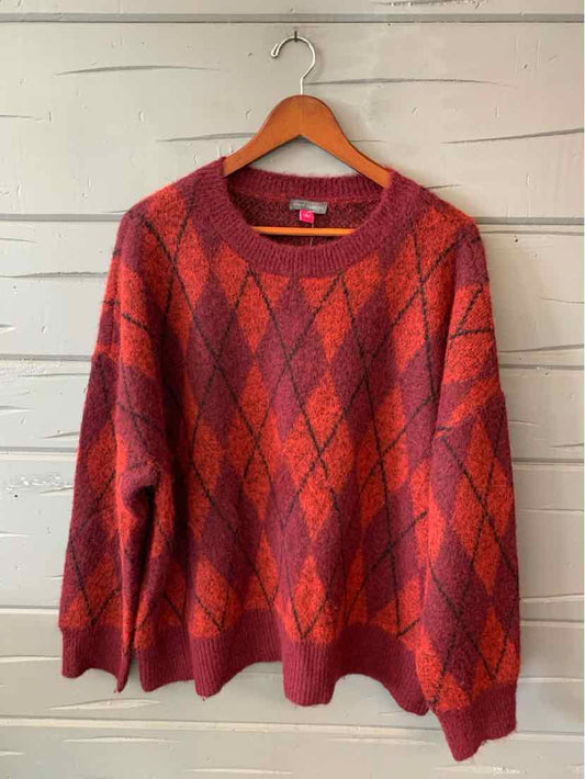 Red Vince Camuto sweater with a dark argyle diamond pattern, long sleeves, and a round neckline.