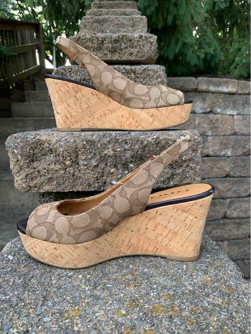Brown Coach monogram wedge sandals with cork platform and slingback strap, size 7.5.