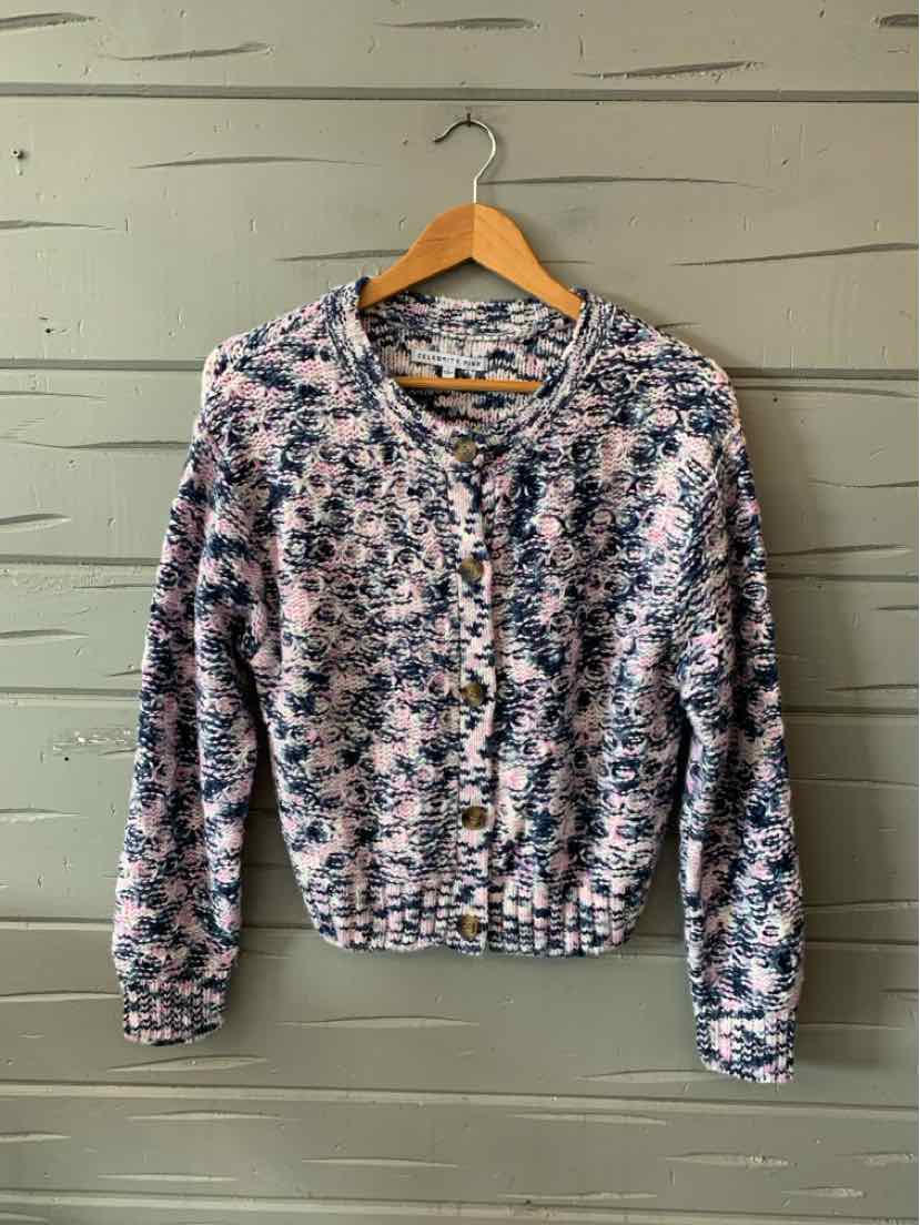 Long-sleeve knit cardigan in pink and blue floral pattern with buttons down front and rounded neckline.
