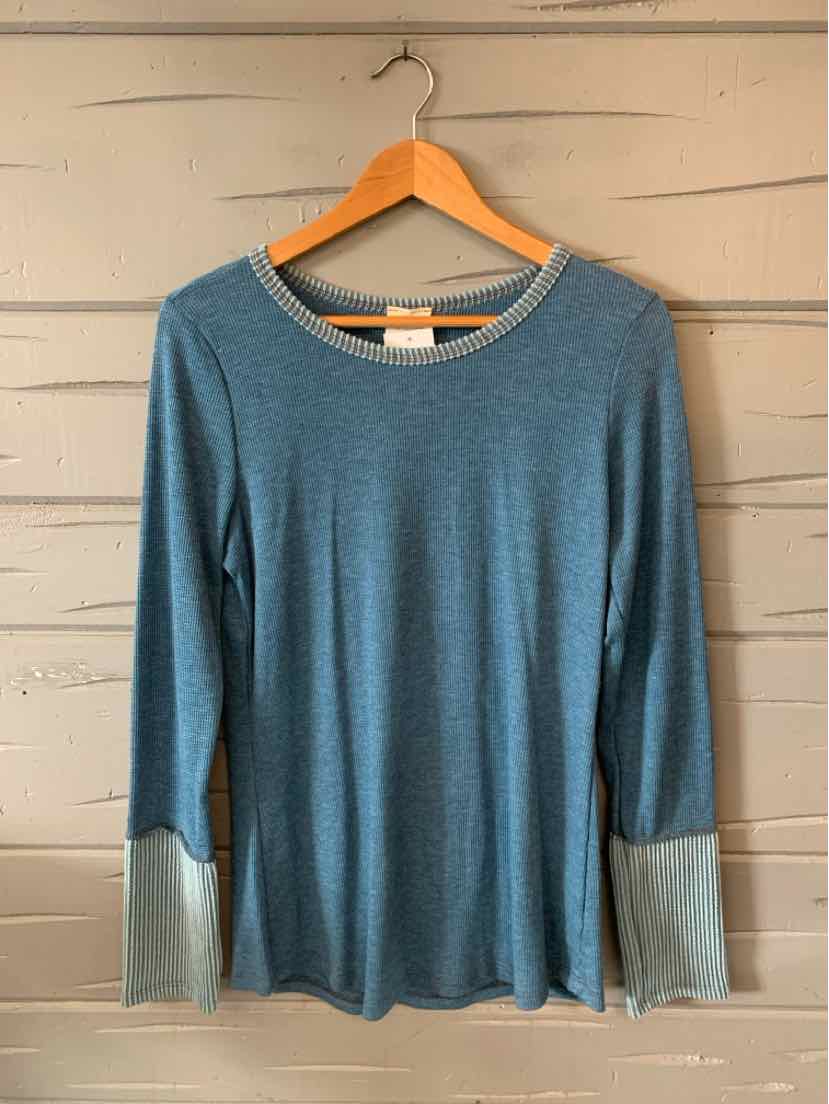 Blue long-sleeve top with lighter blue cuffs and collar, soft fabric, medium size.