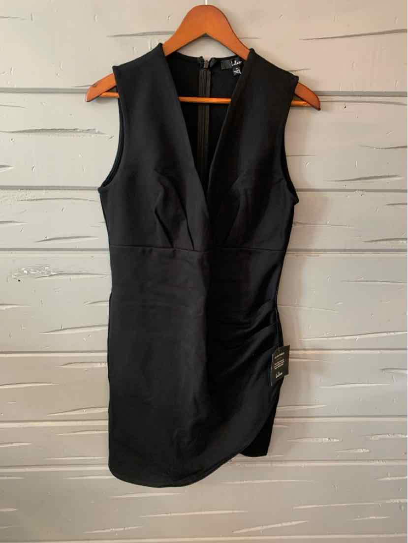 Black sleeveless fitted dress with V-neckline and side draped detail hanging on wooden hanger.