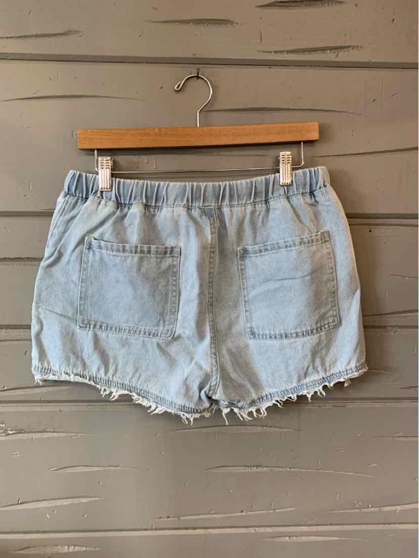 Light blue denim shorts with elastic waistband, frayed hem, and two back patch pockets.