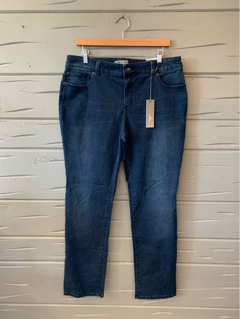 Dark blue denim jeans with a straight-leg cut, five-pocket styling, and a hanging tan tag.