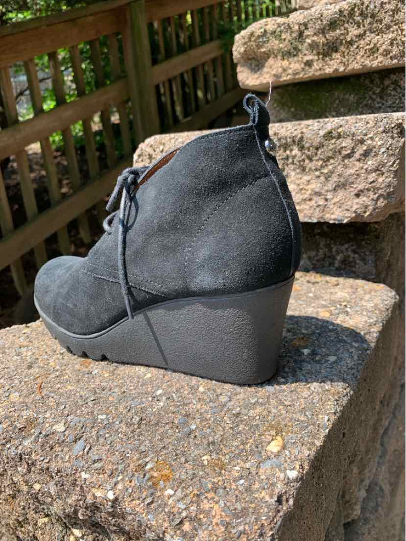 Black suede wedge ankle boot with lace-up front and pull tab at heel, women's size 8.